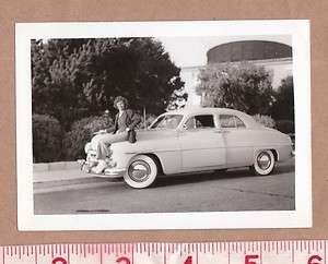   1950 PRETTY SMILING WOMAN SITS ON HOOD OF SHINY NEW MERCURY CAR  