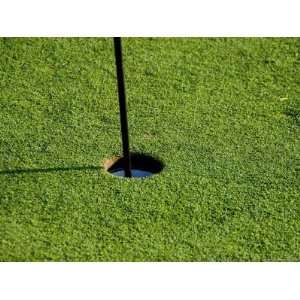  Close View of a Flag Pole in a Hole on a Golf Course 