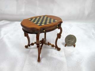 Drawer can open, that checker board made by wood inlay into the table.